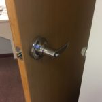 A door handle is shown on the inside of a room.