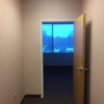 A door open to the outside of an office.