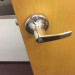 A door handle on the inside of a room.