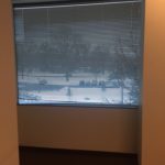 A window with a view of the snow covered ground.