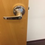 A door handle is shown on the inside of a room.