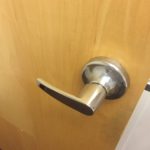 A door handle on the inside of a room.