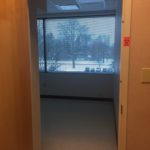 A view of the snow from inside a room.