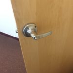 A door handle is shown on the inside of a room.