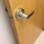 A door handle is shown on the inside of a room.