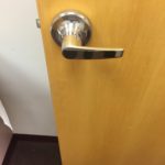 A door handle on the inside of a room.