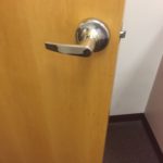 A door handle is shown on the inside of a room.