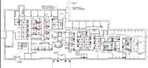 A floor plan of an office building with many cubicles.