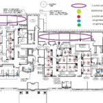 A floor plan of an office building with multiple colored arrows.