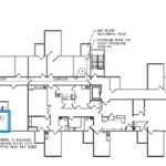 A floor plan of the building with a blue arrow pointing to it.